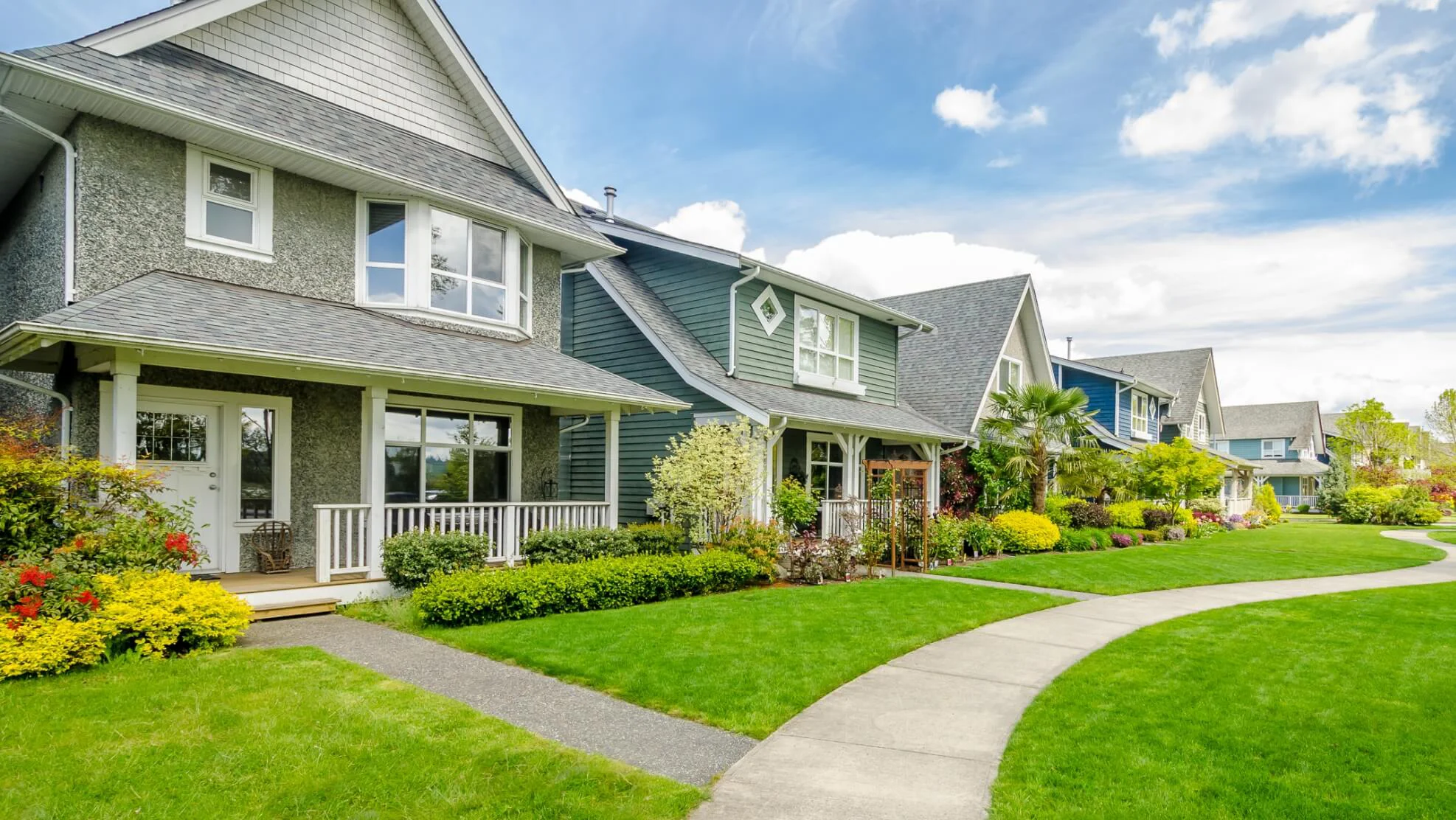 View of a sidewalk in front of several houses